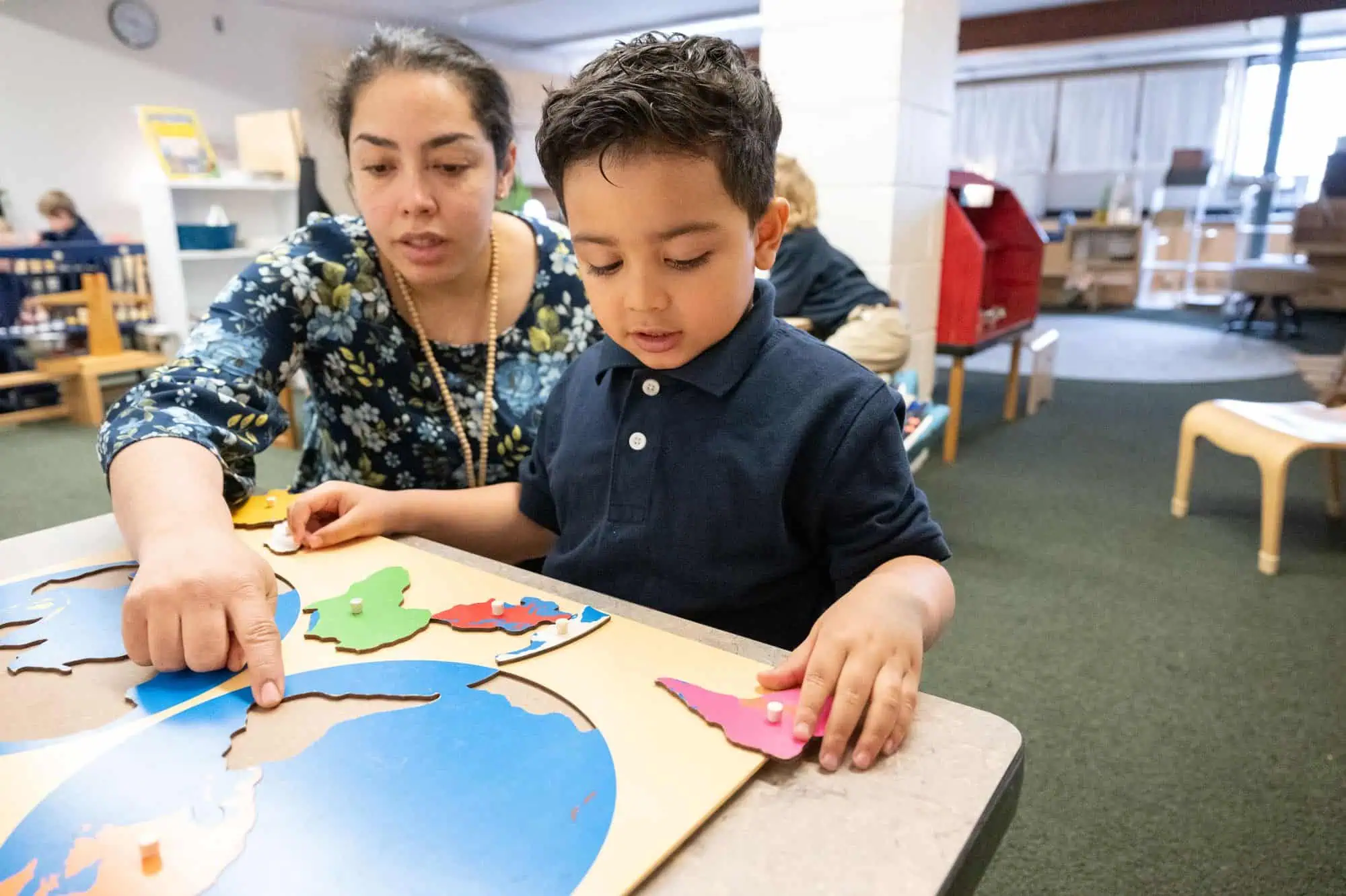 Preschooler learning geography with the Montessori Puzzle Map